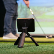 Garmin Approach R10 Launch Monitor in golf simulator with golfer
