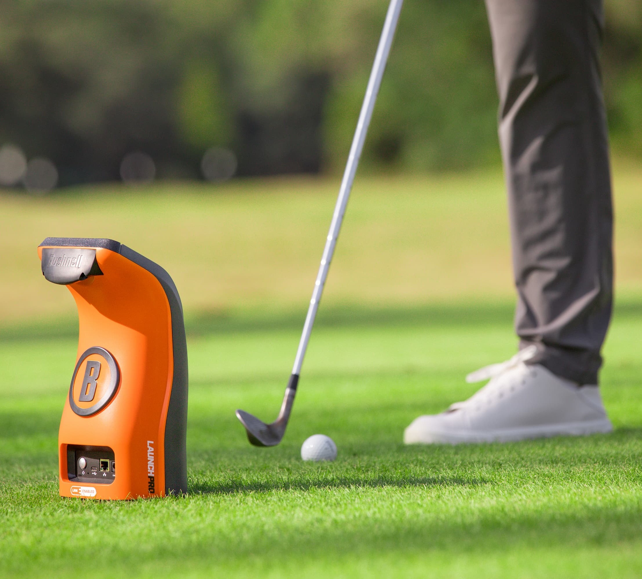 Bushnell LPi with golfer hitting the ball