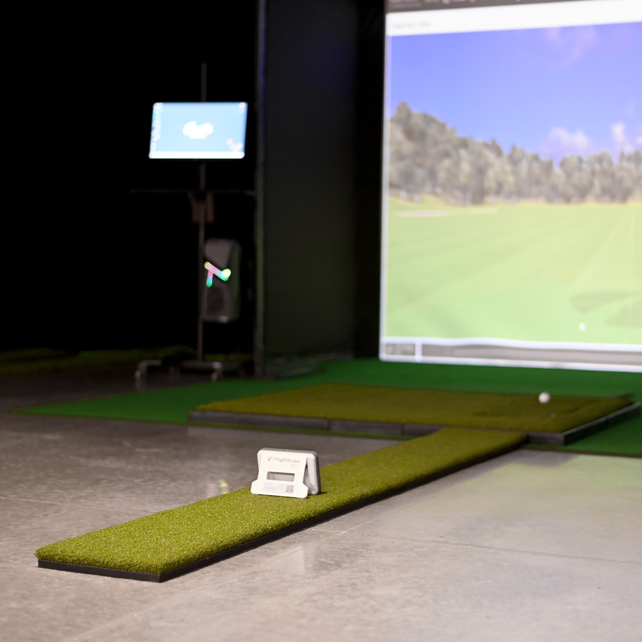 Golfer using Flightscope Mevo+ in Carl's DIY Enclosure