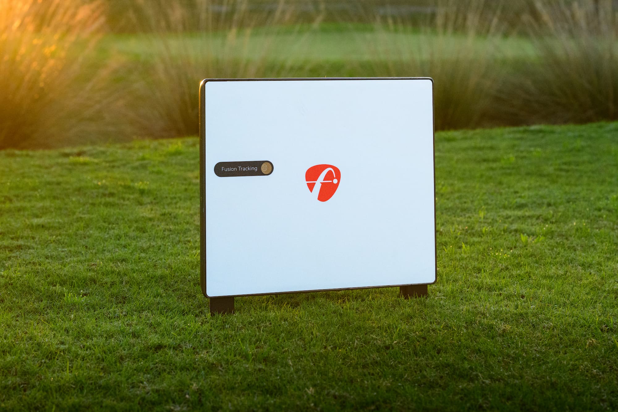 FlightScope X3C launch monitor outside on grass