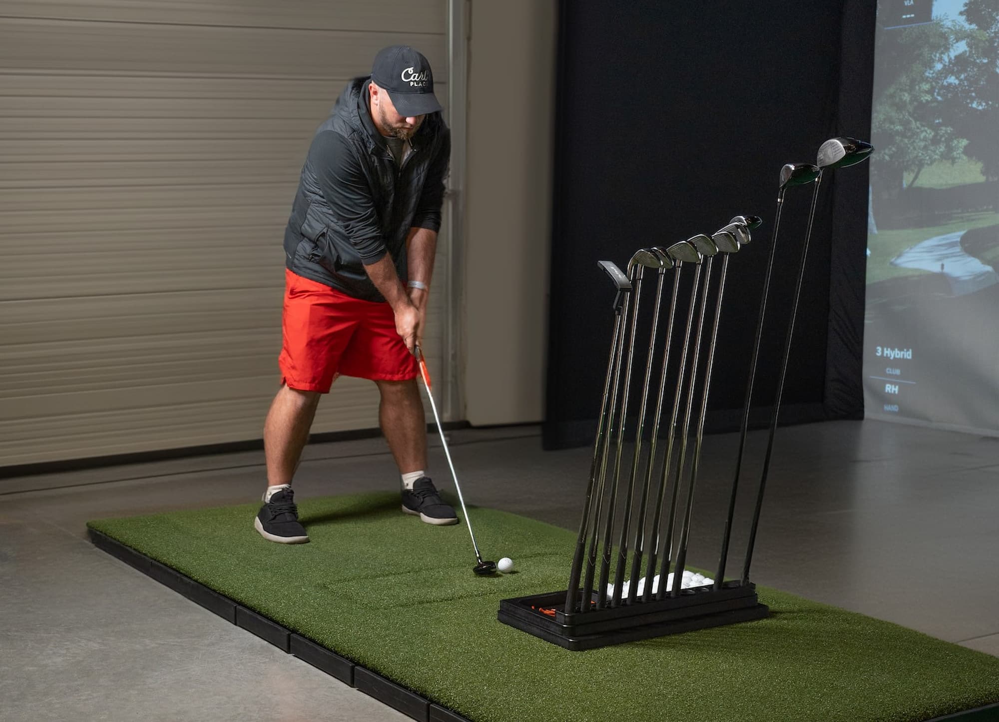 Golfer in simulator ready to swing