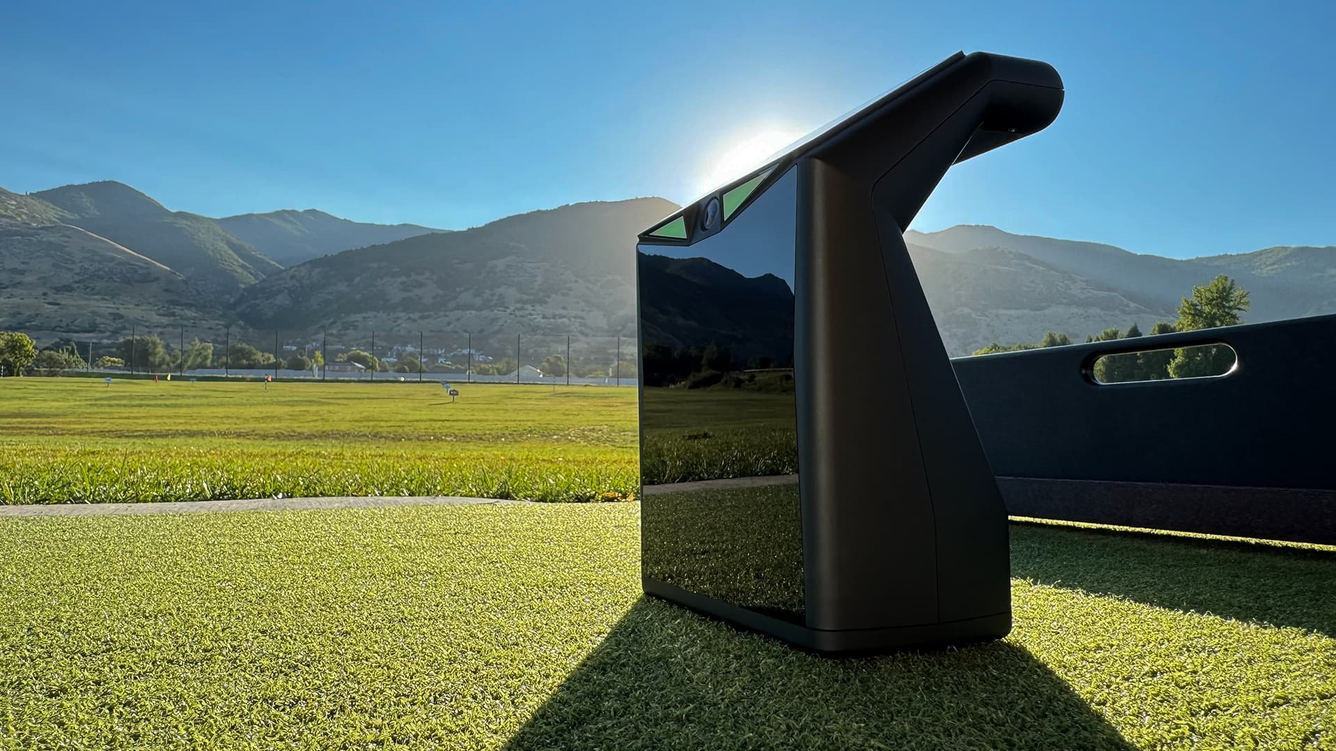 TruGolf Launchbox on turf with sun