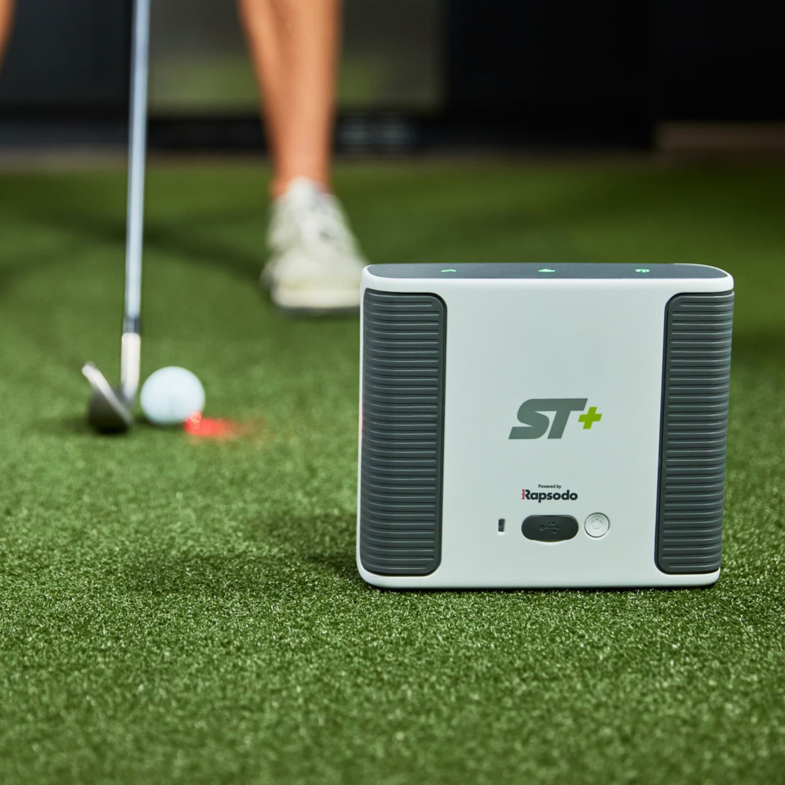 SkyTrak+ Launch Monitor on golf mat