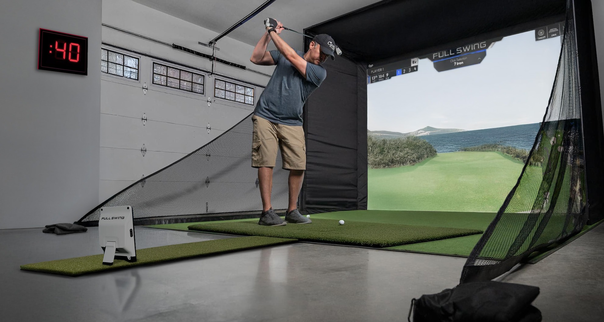 Player swinging in garage with Full Swing Kit launch monitor